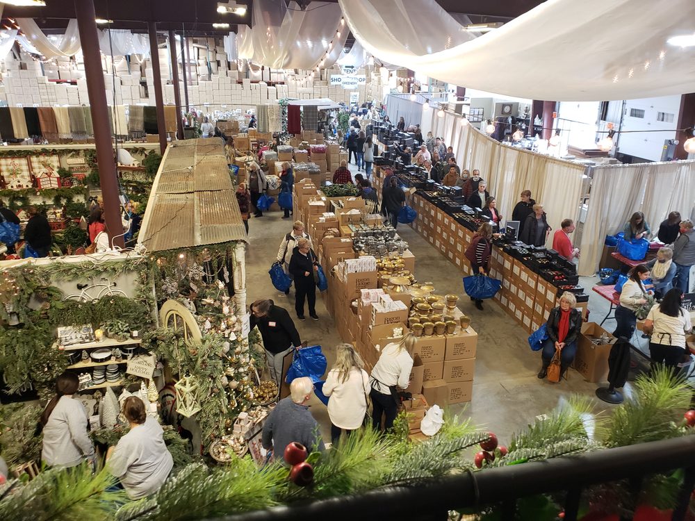 Shoppers filling the warehouse aisles during a holiday sale